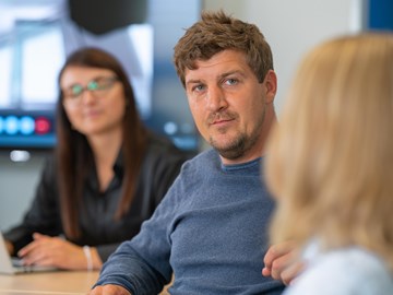 drei Kollegen in Besprechung drei Kollegen in Besprechung